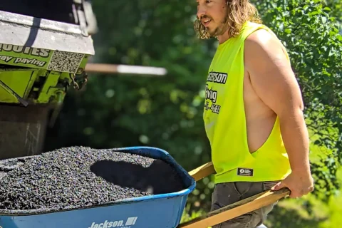 David Gaboury owner of Masterson Paving with a wheelbarrow of HMA